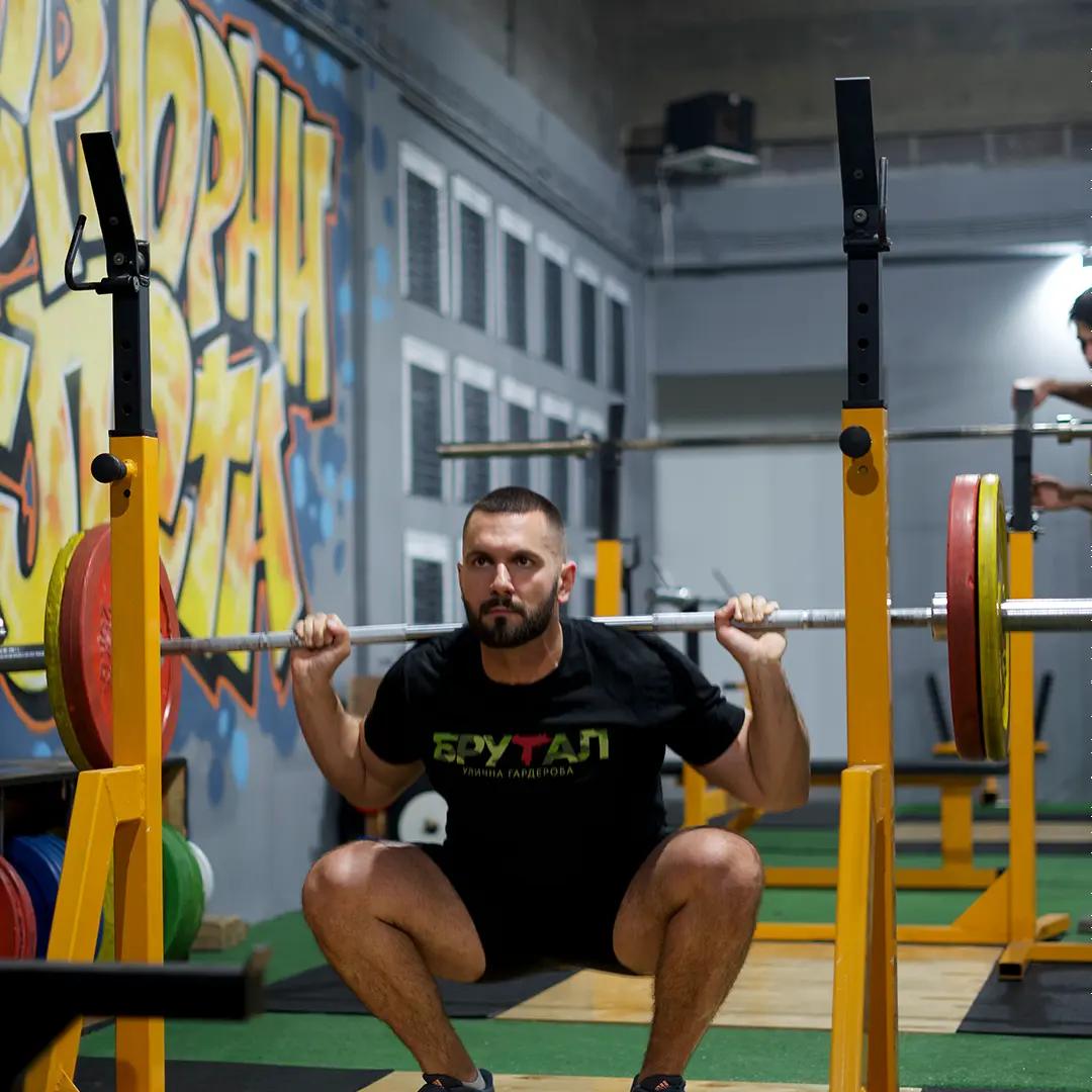 A member doing squats